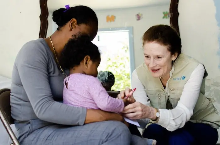 On 19 June 2019 in Tijuana, Mexico UNICEF Executive Director Henrietta Fore speaks with Nadia* and her one-year old child. Nadia is from Guerrero, Mexico. She had to leave her home due to extortion, she was scared for her and her daughter. Now she wants t