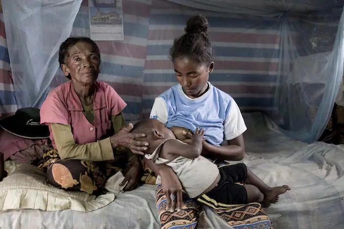 Razafimandimby Olivia, 16, left school when she gave birth to her son, Safidy, at age 15. Thanks to a UNICEF-supported life skills program, she has resumed her education in Ambosary, Anosy Region, Madagascar. 