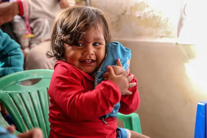  An infant plays in a UNICEF-supported Child Friendly Space in Rumichaca, at the Ecuador-Colombia border, where migrant children and families from Venezuela are receiving assistance. 