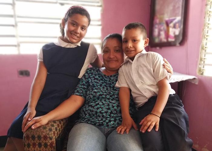 Teacher Laura Albarrán at home with her children, ten-year-old Valeria and 8-year-old Manuel, in Maracaibo, Venezuela in September 2019. 