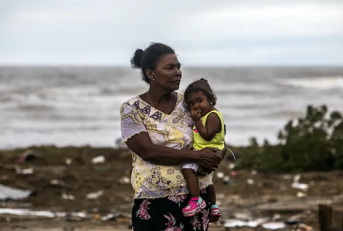 A mother and child survey the damage to their El Muelle neighborhood in Bilwi, Puerto Cabezas, Nicaragua, following Hurricane Eta on Nov. 5, 2020. A mother and child survey the damage to their El Muelle neighborhood in Bilwi, Puerto Cabezas, Nicaragua, following Hurricane Eta on Nov. 5, 2020.