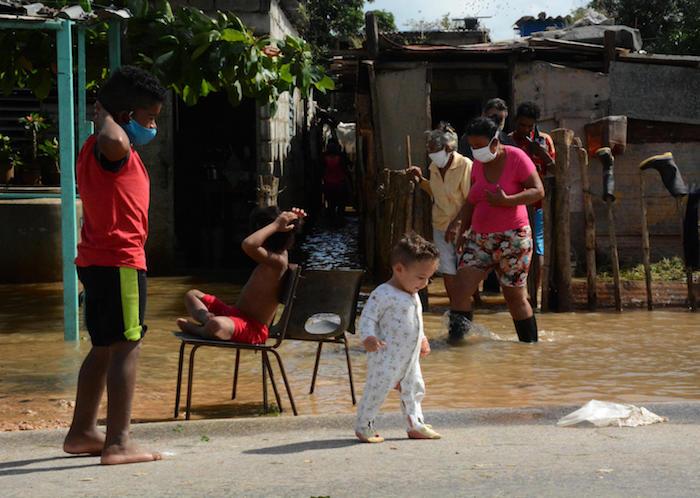 In Cuba on November 8, 2020, children play at Majagua municipality in the province of Ciego de Avila in the aftermath of Tropical Storm Eta. 