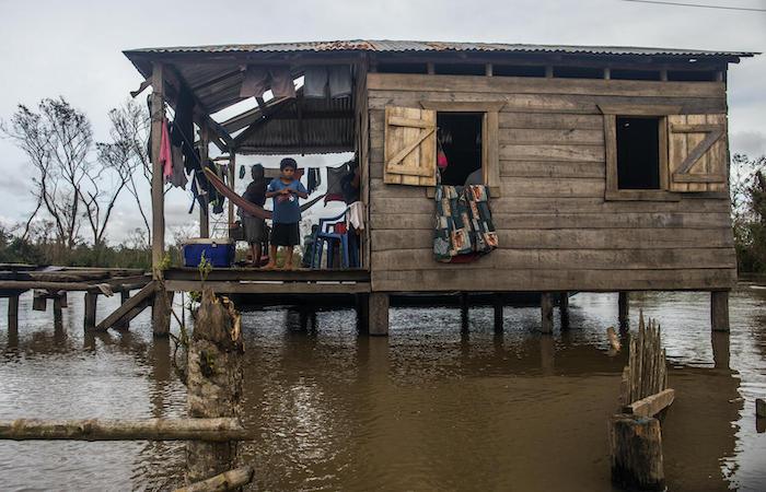 Floodwaters surround a family's home in Bilwi, Nicaragua, in the wake of Hurricane Iota, Nov. 18, 2020.
