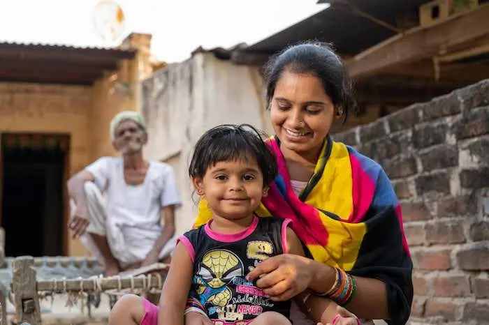 A UNICEF-supported mother and child in Kantivaas Village, Banaskantha, Gujarat, India. A UNICEF-supported mother and child in Kantivaas Village, Banaskantha, Gujarat, India.