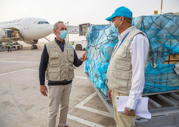 Unicef Representative in Mauritania Marc Lucet (left) with a UNICEF health consultant during delivery of 8,000 antigen-detecting tests to fight COVID-19 in January 2021. 