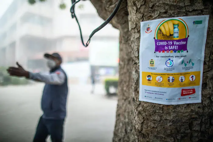 Information posted outside Pt. Madan Mohan Malviya Hospital in lead up to COVID-19 vaccination drive in New Delhi, India.
