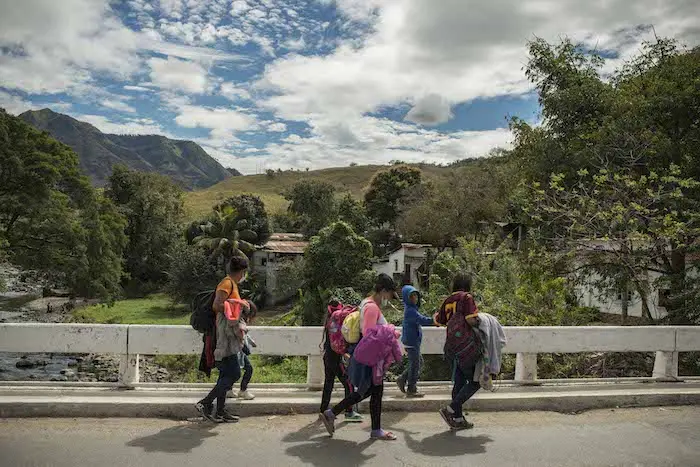 A family from Honduras makes their way into Guatemala, heading north.