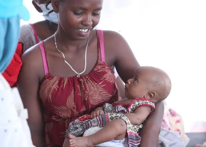 A mother and child, refugees from Tigray region of Ethiopia, photographed on Nov. 21, 2020, at the UNICEF-supported Hamdayet Reception Center in Gedarif, Sudan. 