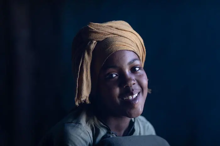 In Ethiopia, girl smiles into the camera In Ethiopia, girl smiles into the camera