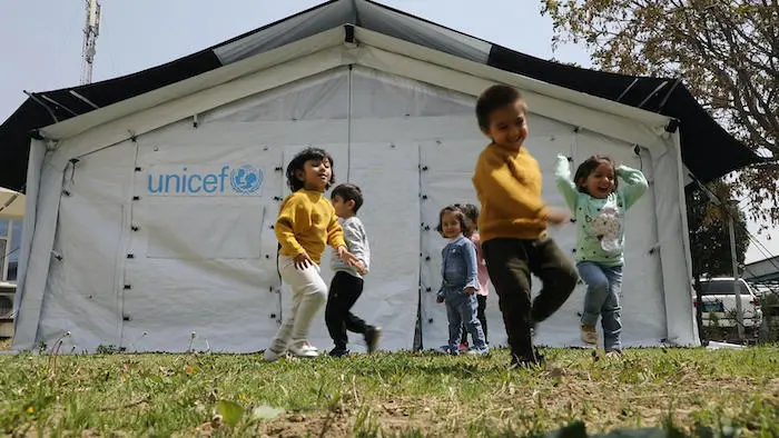Children play inside and outside new high performance tents UNICEF recently installed in Afghanistan to be used for community-based education programs. Children play inside and outside new high performance tents UNICEF recently installed in Afghanistan to be used for community-based education programs.