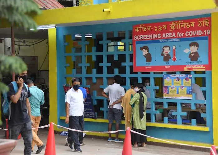 COVID-19 patients line up outside MMC Covid hospital in Guwahati on April 30, 2021. 