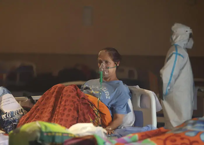 On May 2, 2021, a patient receives treatment in a banquet hall, temporarily converted into a COVID-19 emergency ward in New Delhi, India. On May 2, 2021, a patient receives treatment in a banquet hall, temporarily converted into a COVID-19 emergency ward in New Delhi, India.