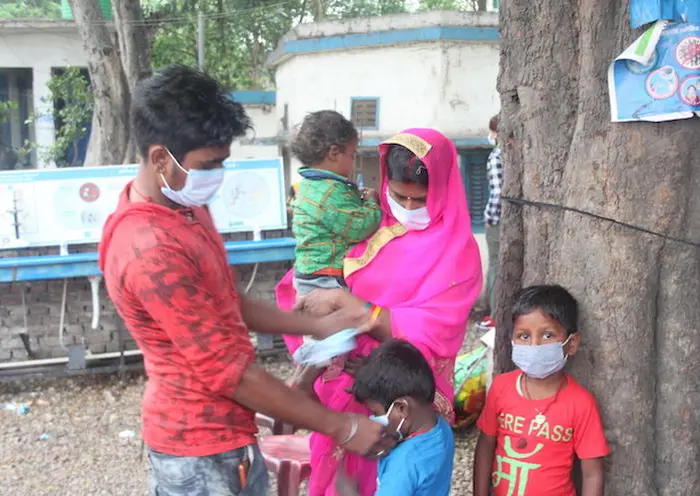 On May 5, 2021, a family makes the crossing from India into Nepal at the Birgunj point of entry in Parsa District in southern Nepal. On May 5, 2021, a family makes the crossing from India into Nepal at the Birgunj point of entry in Parsa District in southern Nepal.