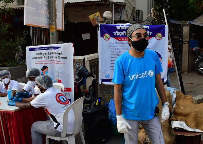 In a suburb of Mumbai on May 8, 2021, UNICEF Maharashtra WASH Specialist Yusuf Kabir and Alert Citizen Forum activists register people to coordinate the delivery of COVID-19 vaccines in India.