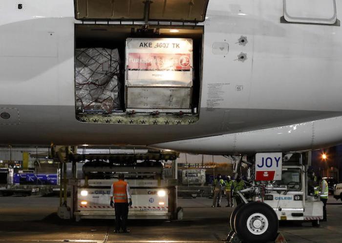 Ground staff prepare to unload the coronavirus (COVID-19) medical supplies sent by UNICEF, upon the arrival of a cargo plane at the Indira Gandhi International Airport in New Delhi on May 18, 2021.