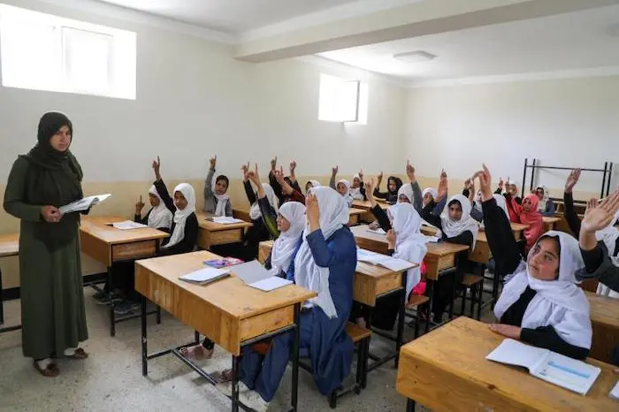 Girls attend school in Afghanistan.