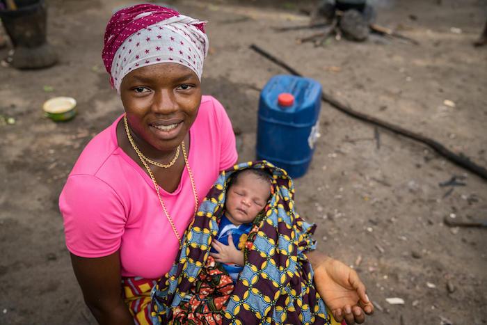 Makalai Kamara, holding her 3-day-old baby in Masiaka Community, Kambia District, Sierra Leone, received mental health and psychosocial support during her pregnancy through a UNICEF-supported Caring for the Caregiver program.