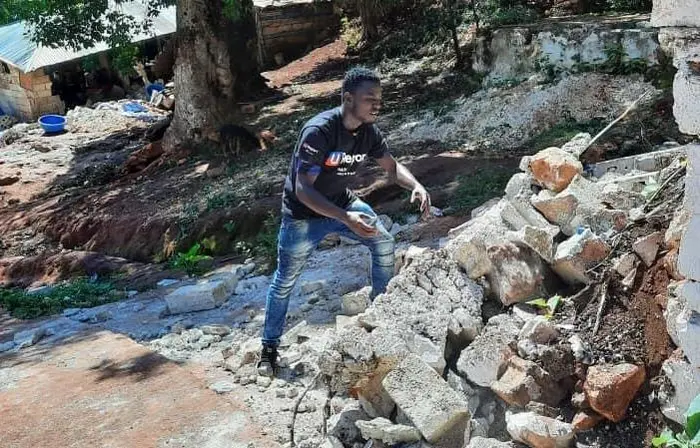 On August 14, 2021, Wadlet Merant, U-reporter from Peslet, moves earthquake rubble in Peslet, Haiti. 