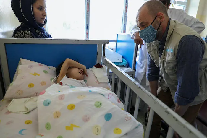 UNICEF's chief of emergency programs Manuel Fontaine interacts with a child at a malnutrition treatment ward at the Indira Gandhi Children's Hospital in Kabul. UNICEF's chief of emergency programs Manuel Fontaine interacts with a child at a malnutrition treatment ward at the Indira Gandhi Children's Hospital in Kabul.