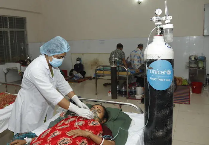 A health worker provides a patient with oxygen provided by UNICEF at a hospital in Barishal, Bangladesh. A health worker provides a patient with oxygen supplied by UNICEF at a hospital in Barishal, Bangladesh