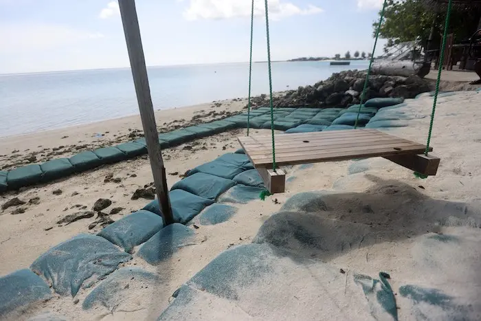 Sandbags line a beach on Dhiffushi to protect against sea level rise. Maldives is the lowest lying country in the world and a number of techniques are used to protect islands against flooding and erosion. Nevertheless, the country is expected to be entire Sandbags line a beach on Dhiffushi to protect against sea level rise. Maldives is the lowest lying country in the world and a number of techniques are used to protect islands against flooding and erosion. Nevertheless, the country is expected to be entire