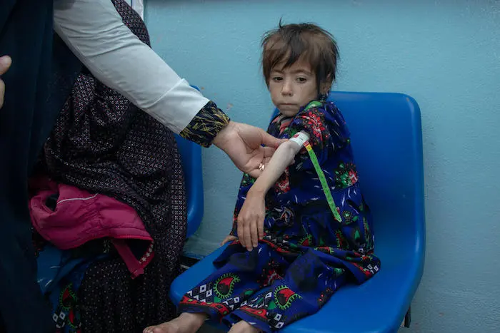 Health workers use a Mid-Upper Arm Circumference (MUAC) measuring strip to diagnose malnutrition in children. Health workers use a Mid-Upper Arm Circumference (MUAC) measuring strip to diagnose malnutrition in children.