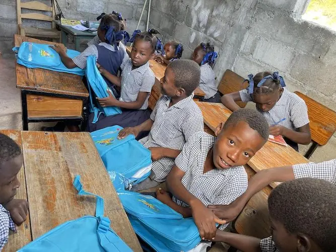 Students in Port-Salut in Les Cayes department, Haiti, received learning materials from UNICEF after the August 2021 earthquake destroyed their school. Students in Port-Salut in Les Cayes department, Haiti, received learning materials from UNICEF after the August 2021 earthquake destroyed their school.