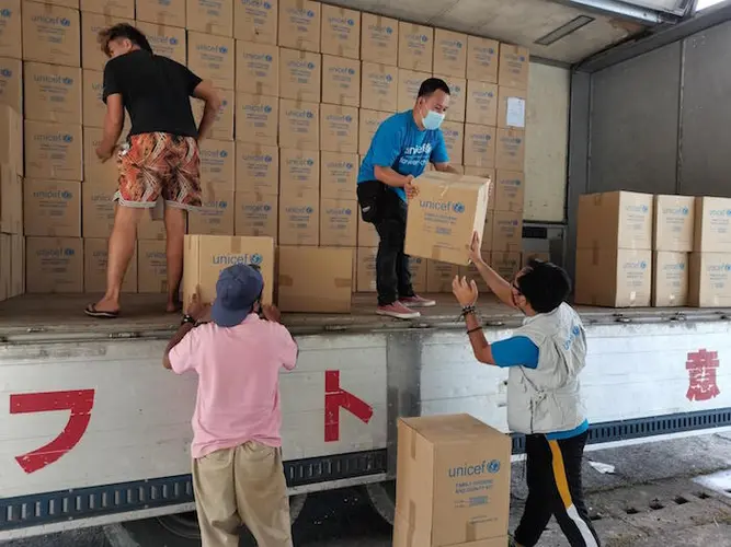 UNICEF staff unload emergency supplies for children and families in urgent need after Super Typhoon Rai hit the Philippines on December 16, 2021. UNICEF staff unload emergency supplies for children and families in urgent need after Super Typhoon Rai hit the Philippines on December 16, 2021.