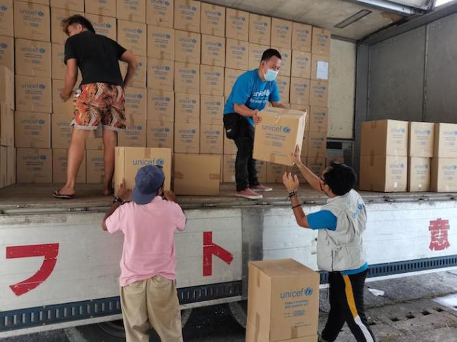 UNICEF staff unload emergency supplies for children and families in urgent need after Super Typhoon Rai hit the Philippines on December 16, 2021.