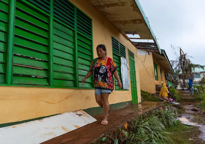 Nelly Cariño walks to the classroom where most members of her family have evacuated. More than a week after Typhoon Odette wreaked havoc on Dinagat Island, the family still can’t go home. They don’t have enough resources to rebuild what they have lost. Nelly Cariño walks to the classroom where most members of her family have evacuated. More than a week after Typhoon Odette wreaked havoc on Dinagat Island, the family still can’t go home. They don’t have enough resources to rebuild what they have lost.