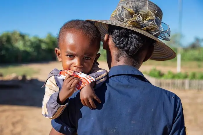 Two-year-old Razafimandimby of Bevoalavo village, Madagascar, consumes a packet of Ready-to-Use Therapeutic Food supplied by UNICEF, treatment for severe malnutrition. Two-year-old Razafimandimby of Bevoalavo village, Madagascar, consumes a packet of Ready-to-Use Therapeutic Food supplied by UNICEF, treatment for severe malnutrition.