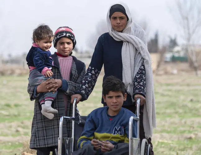 Four siblings who have endured much suffering and loss due to the war in Syria outside their home in Nashabieh, in East Ghouta, rural Damascus. Four siblings who have endured much suffering and loss due to the war in Syria outside their home in Nashabieh, in East Ghouta, rural Damascus.