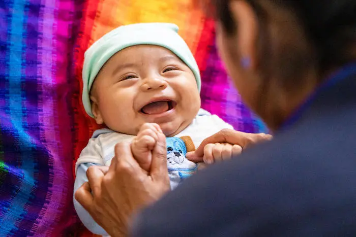 A mother and baby participate in an early childhood development workshop organized by a UNICEF-supported community center in Chirrepec, Alta Verapaz, Guatemala.