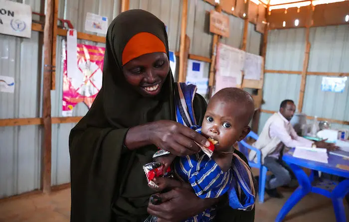 0-month-old Ubah is fed RUTF (Ready-to-Use Therapeutic Food) by her mother at UNICEF-supported Dollow Health Center in Somalia 0-month-old Ubah is fed RUTF (Ready-to-Use Therapeutic Food) by her mother at UNICEF-supported Dollow Health Center in Somalia.