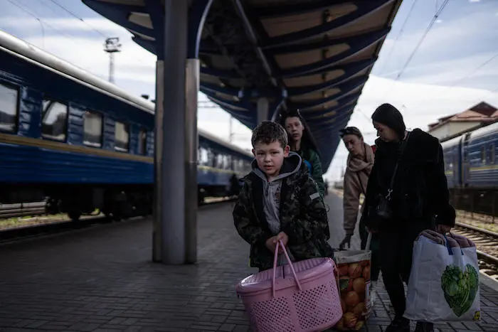 On April 8, 2022 in Ukraine, displaced families from Odesa arrive at the railway station in Uzhhorod, a destination for people fleeing fighting throughout the country. On April 8, 2022 in Ukraine, displaced families from Odesa arrive at the railway station in Uzhhorod, a destination for people fleeing fighting throughout the country.