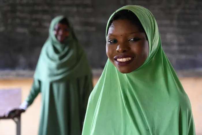Fati, a 14 years old girl, in Diffa, in the southeast of Niger, smiles at the camera. Fati, a 14 years old girl, in Diffa, in the southeast of Niger, smiles at the camera.