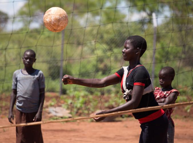 Girls play volleyball at a UNICEF-supported Child-Friendly Space in the Bidi Bidi settlement in Uganda for refugees from South Sudan.