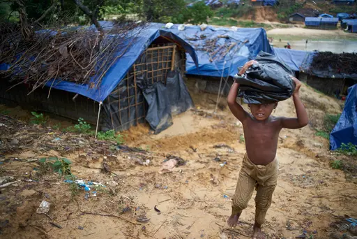 Here, a little girl, one of the hundreds of thousands of Rohingya refugees in Bangladesh, is bringing a tarp back to her family to help repair their damaged shelter. UNICEF Inspired Gifts tarps help protect families and their children after natural disasters strike. Shop UNICEF Inspired Gifts