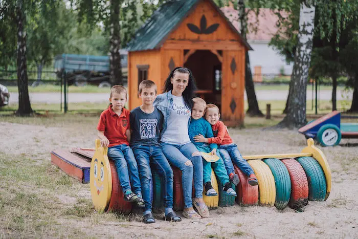 A mother with her four children in a park in Ukraine A mother with her four children in a park in Ukraine