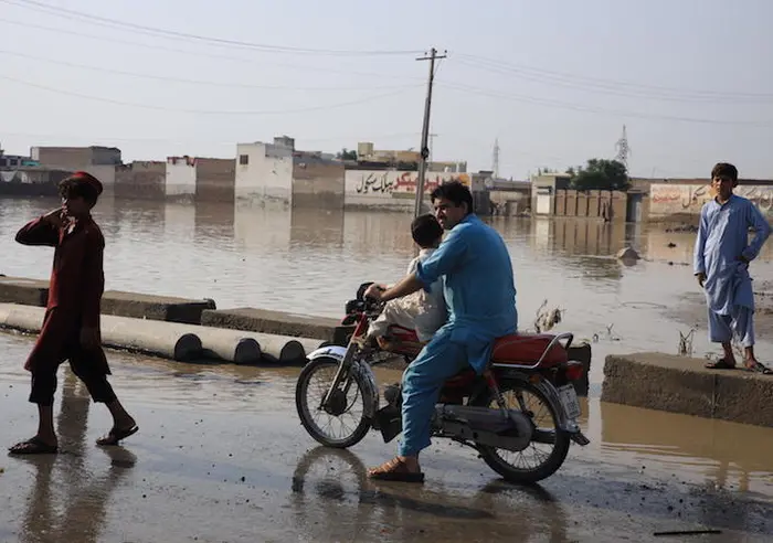 On Aug. 30,2022, people negotiate floodwaters in Khyber Pakhtunkhwa Province, Pakistan. On Aug. 30,2022, people negotiate floodwaters in Khyber Pakhtunkhwa Province, Pakistan.