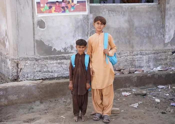 Brothers outside a Temporary Learning Center set up by UNICEF after floods in Sindh Province, Pakistan. Brothers outside a Temporary Learning Center set up by UNICEF after floods in Sindh Province, Pakistan.