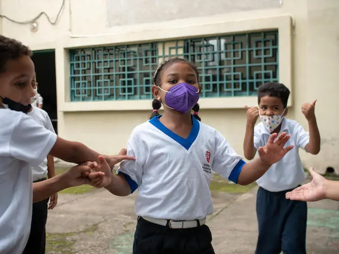 Children playing in the backyard at a UNICEF-supported school in Caracas, Venezuela, on July 6, 2022. Children playing in the backyard at a UNICEF-supported school in Caracas, Venezuela, on July 6, 2022.