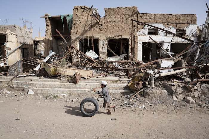 A young Yemeni boy plays alongside buildings damaged by fighting in Saada Governorate. This area was once home to Saada's oldest market, where thousands of people sold vegetables, spices and fabrics from storefronts and street stalls. © UNICEF/UN073958/Cl