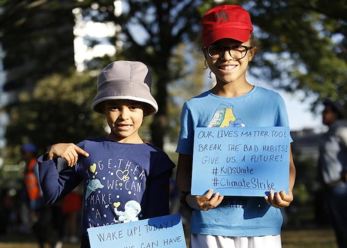 On 20 September 2019 in New York City, (left) Ellie, 8, and her sister Lena, 10, join other youth climate activists in a demonstration calling for global action to combat climate change. 