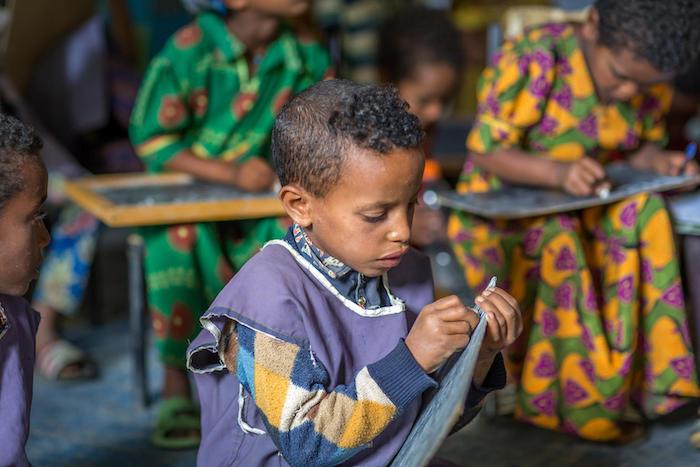 A boy practices his writing skills at UNICEF-supported Mequat Primary School in Ethiopia's Tigray region.