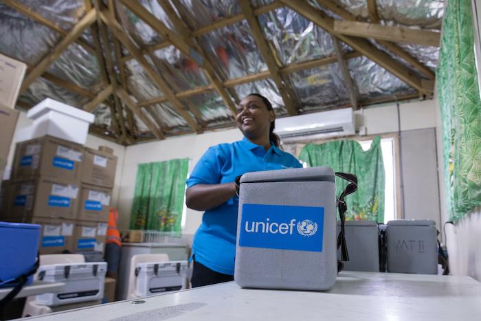 Dr. Frances Vulivuili, UNICEF Health and Nutrition Specialist, prepares cold boxes for vaccination teams at Tupua Tamasese Meaole Hospital in Apia, Samoa.