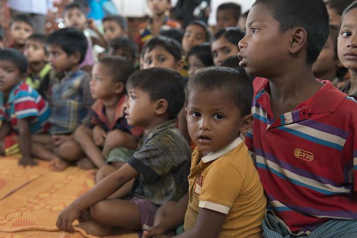 Rohingya refugee children gathered at a UNICEF-supported learning center inside the Balukhali Camp, Cox's Bazar, Bangladesh.