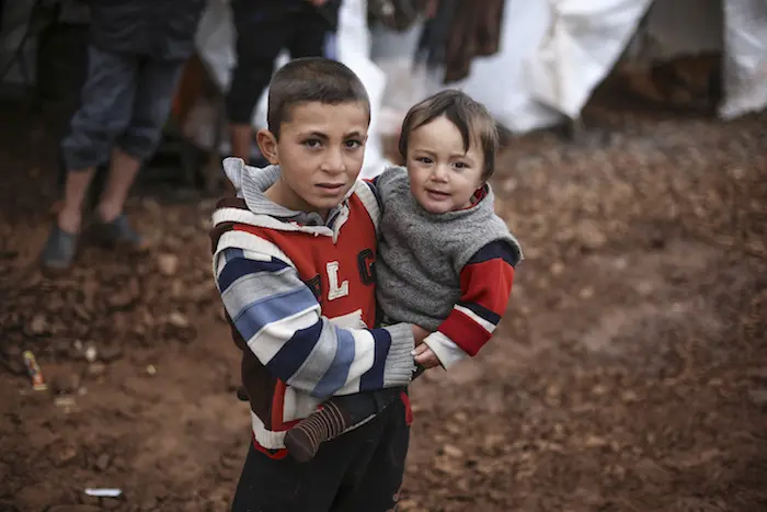 Displaced Syrian children staying in an informal tented settlement, near Alqah village, close to the Syrian-Turkish border, northwest Syria.