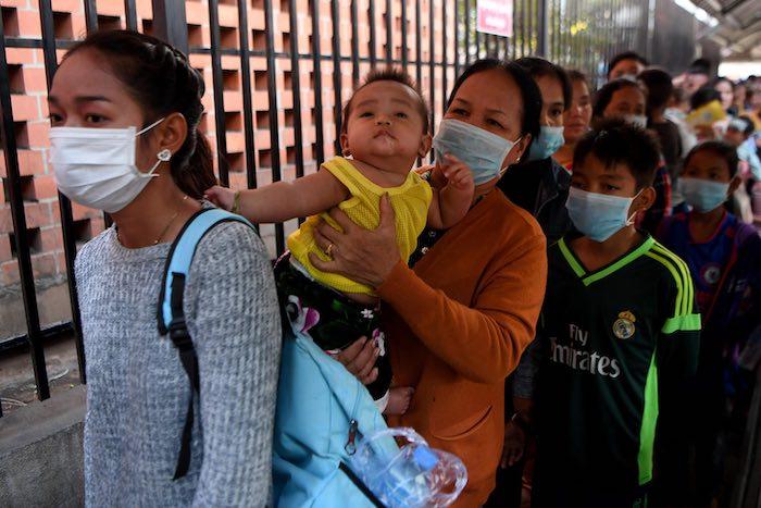 In Cambodia in late January, after the first case of novel coronavirus was reported in the country, people, like these women outside a Phnom Penh children's hospital, began wearing face masks. Despite popular belief, masks should only be worn by people wh