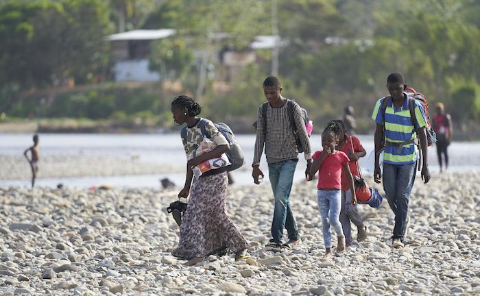 A migrant family on the move completes a treacherous river crossing to enter Panama, a country of transit for those making their way north in search of a better life.